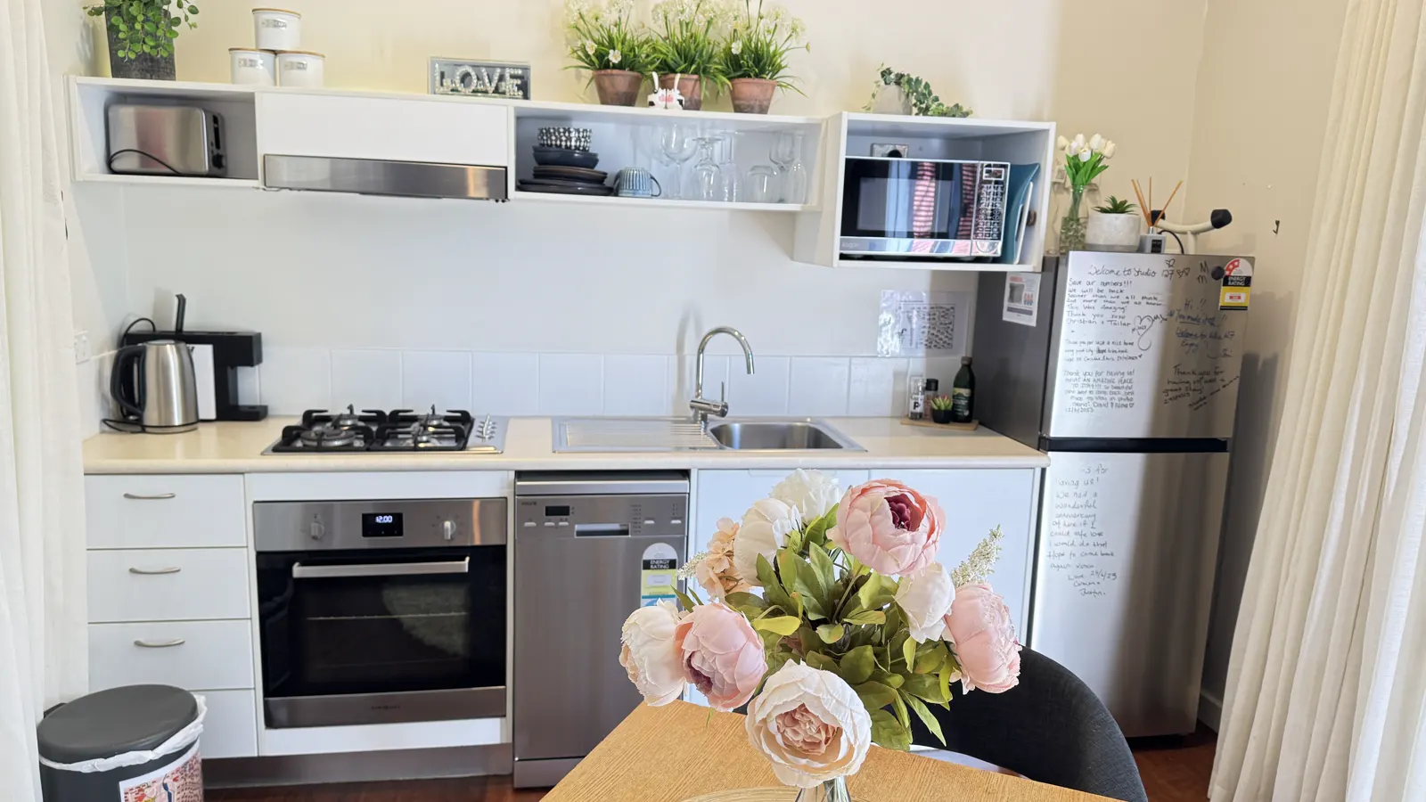 Self-contained kitchen with oven, microwave and a dining table — Studio Spa Villa 127, Cowes, Phillip Island