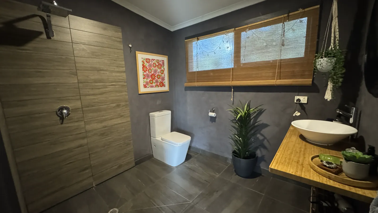 Modern tiled bathroom with shower, toilet and timber vanity — Couples Private Spa Retreat Villa 117, Cowes, Phillip Island