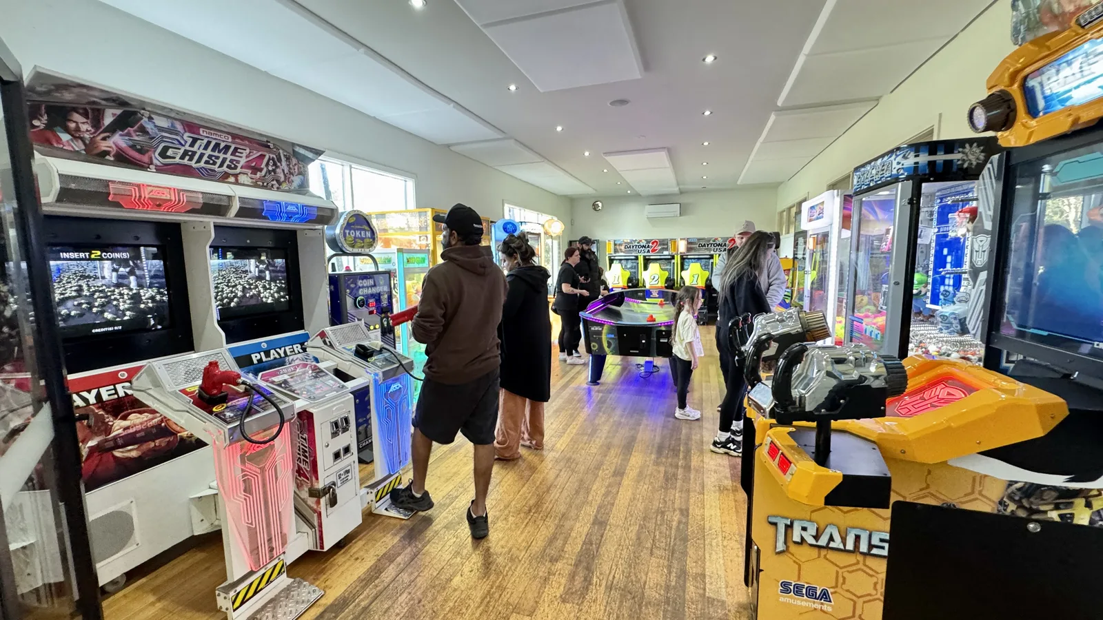 Guests enjoying arcade machines inside the resort Games Zone