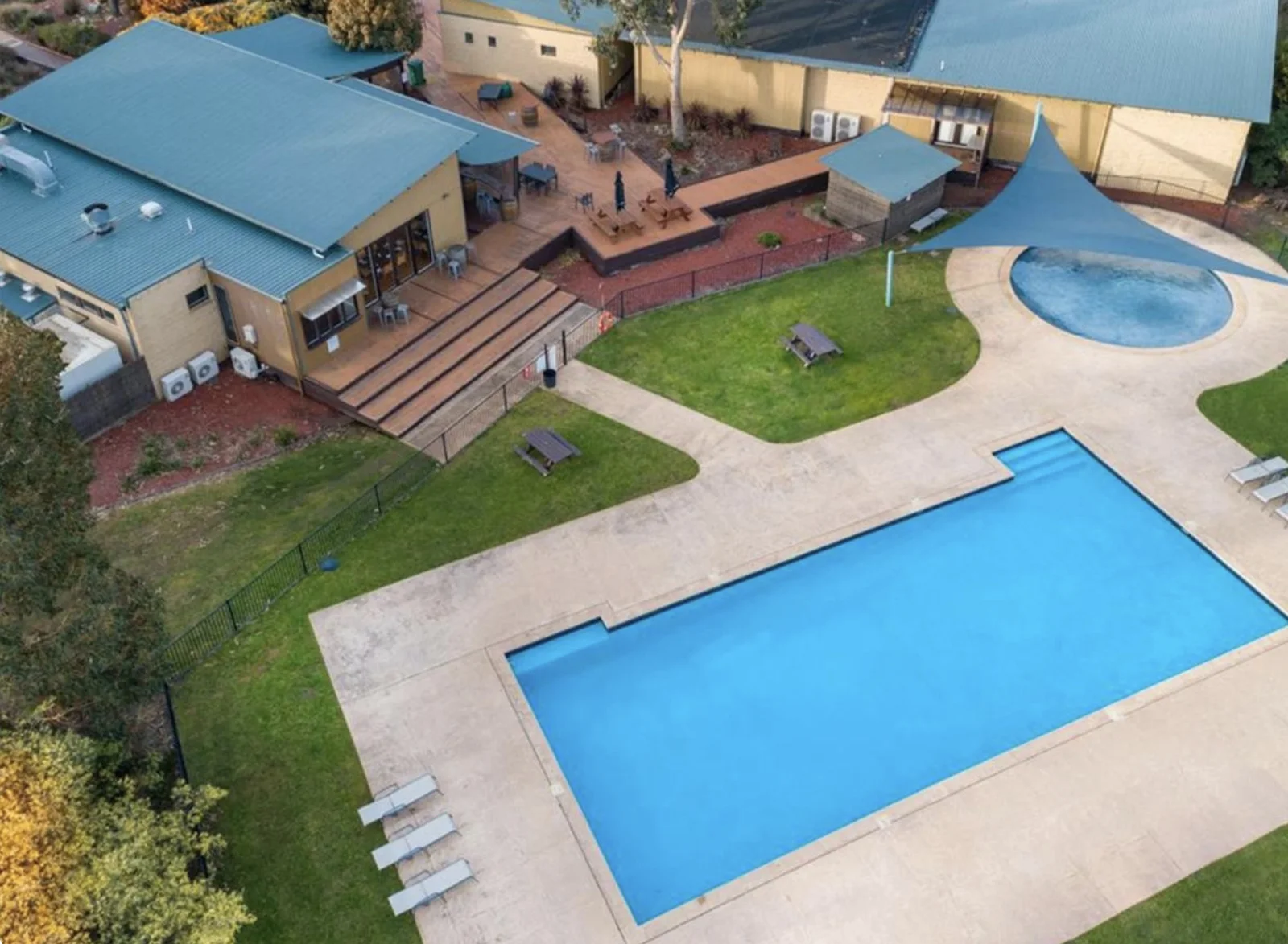 Aerial view of the resort outdoor pools, lawns and recreation buildings