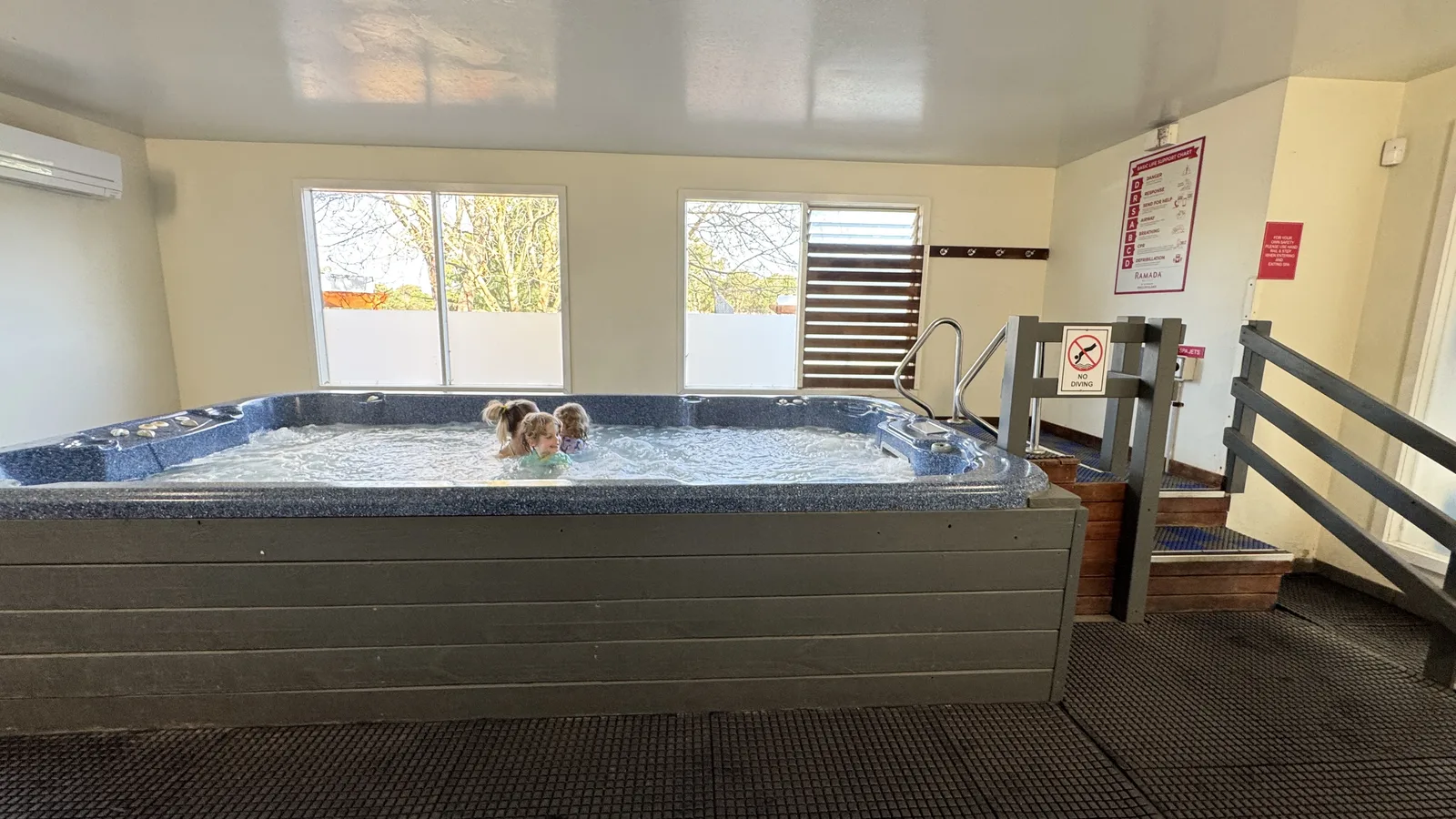 Guests enjoying the resort indoor swim spa